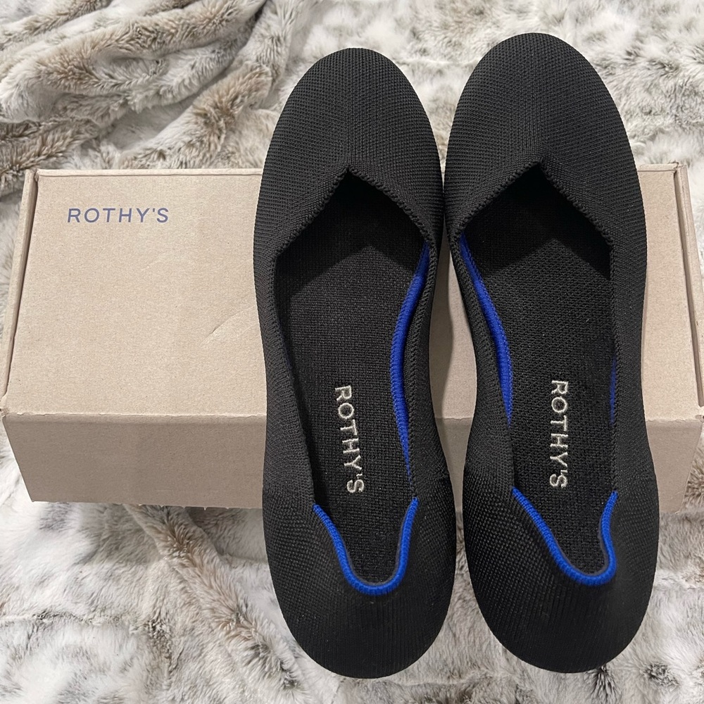 Size 11 Rothy’s Black flat shoes; pre-loved.